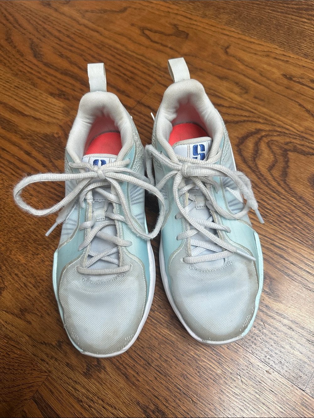 Nike Sabrina Kids Light Blue and White Basketball shoes.